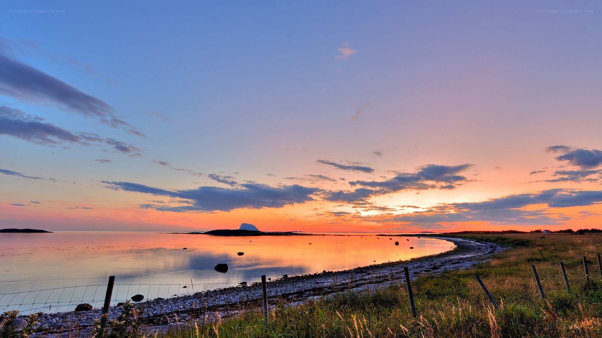 Sunset over coastal landscape
