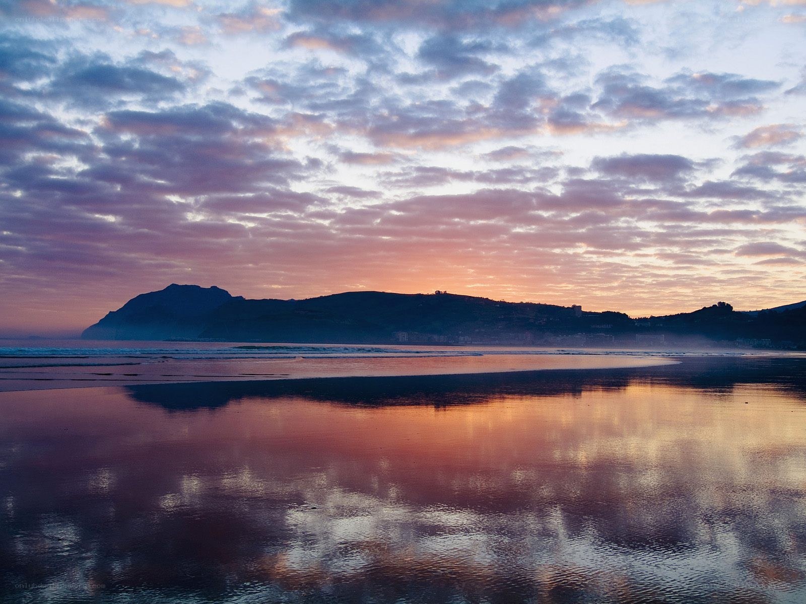 sunset over coastal landscape