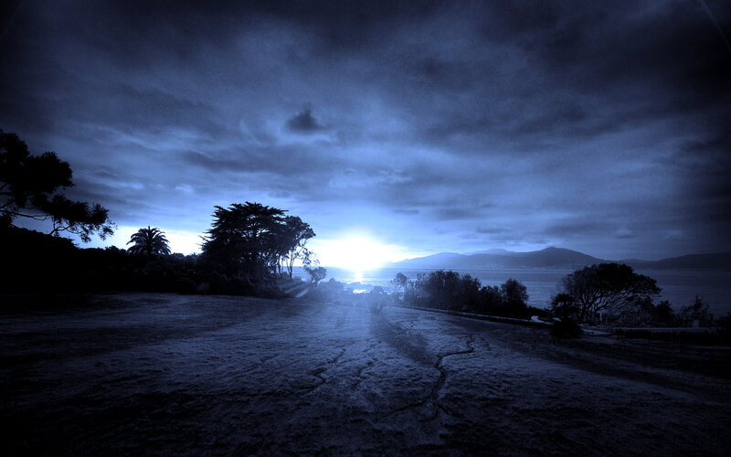 Sunset over Coastal Landscape — Blue, Dramatic, Photograph