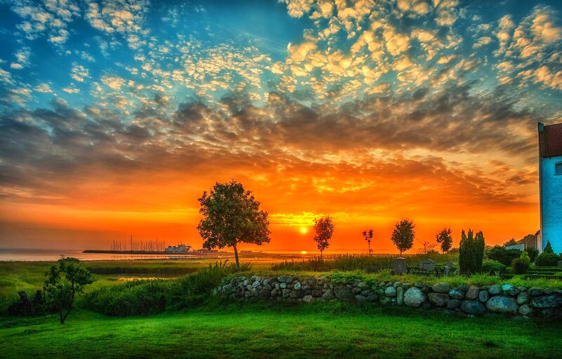 Sunset over Coastal Landscape — Orange, Dramatic
