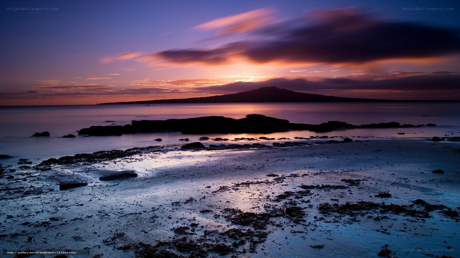 Sunset over coastal landscape