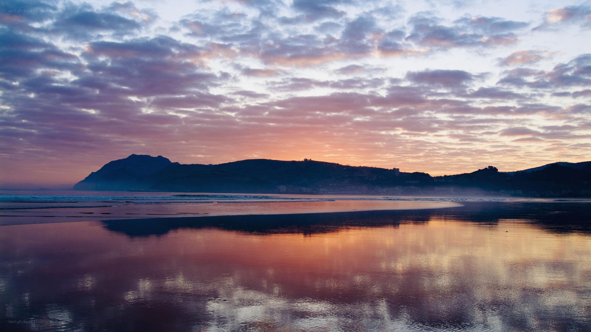 sunset over coastal mountains