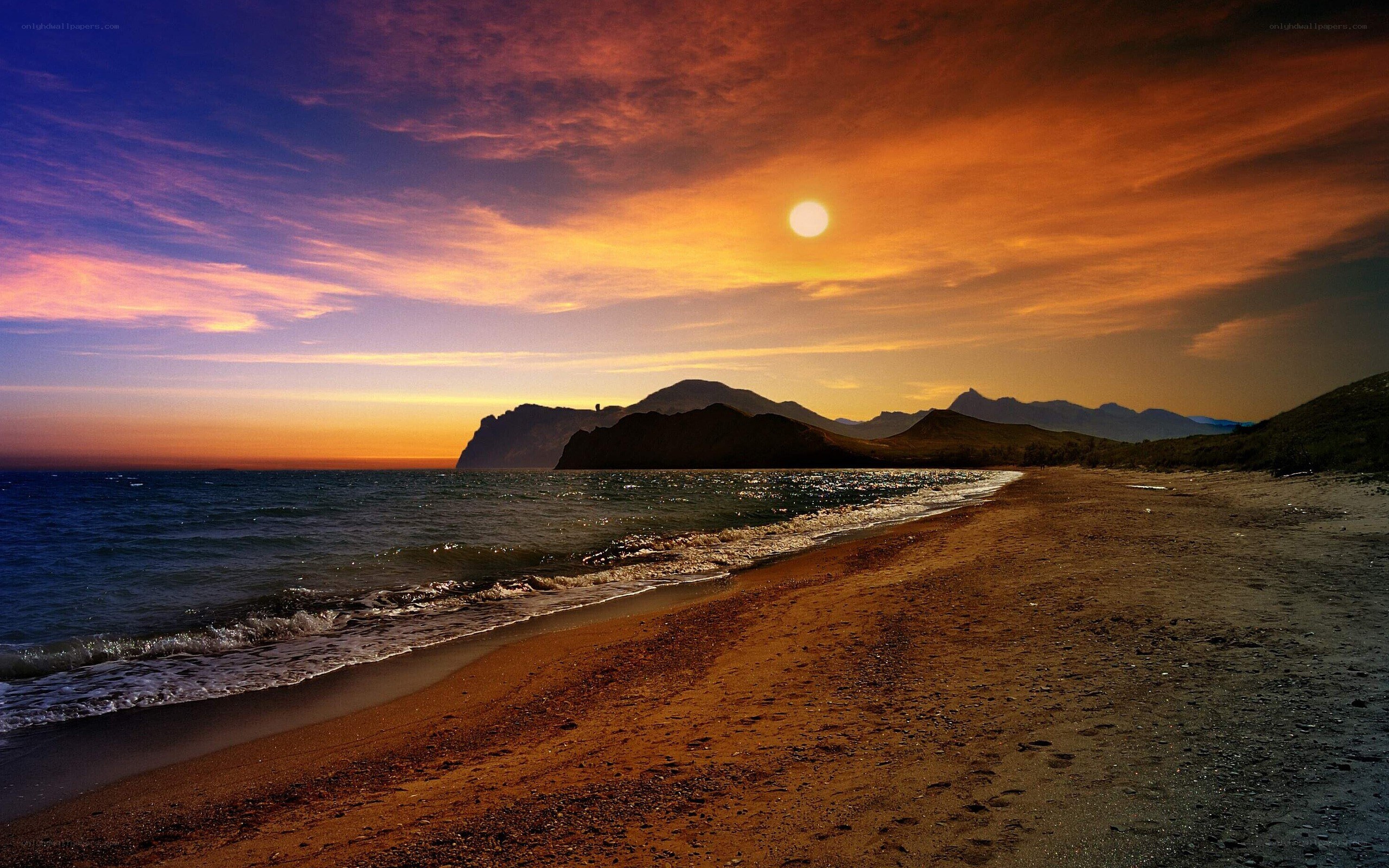 sunset over coastal mountains
