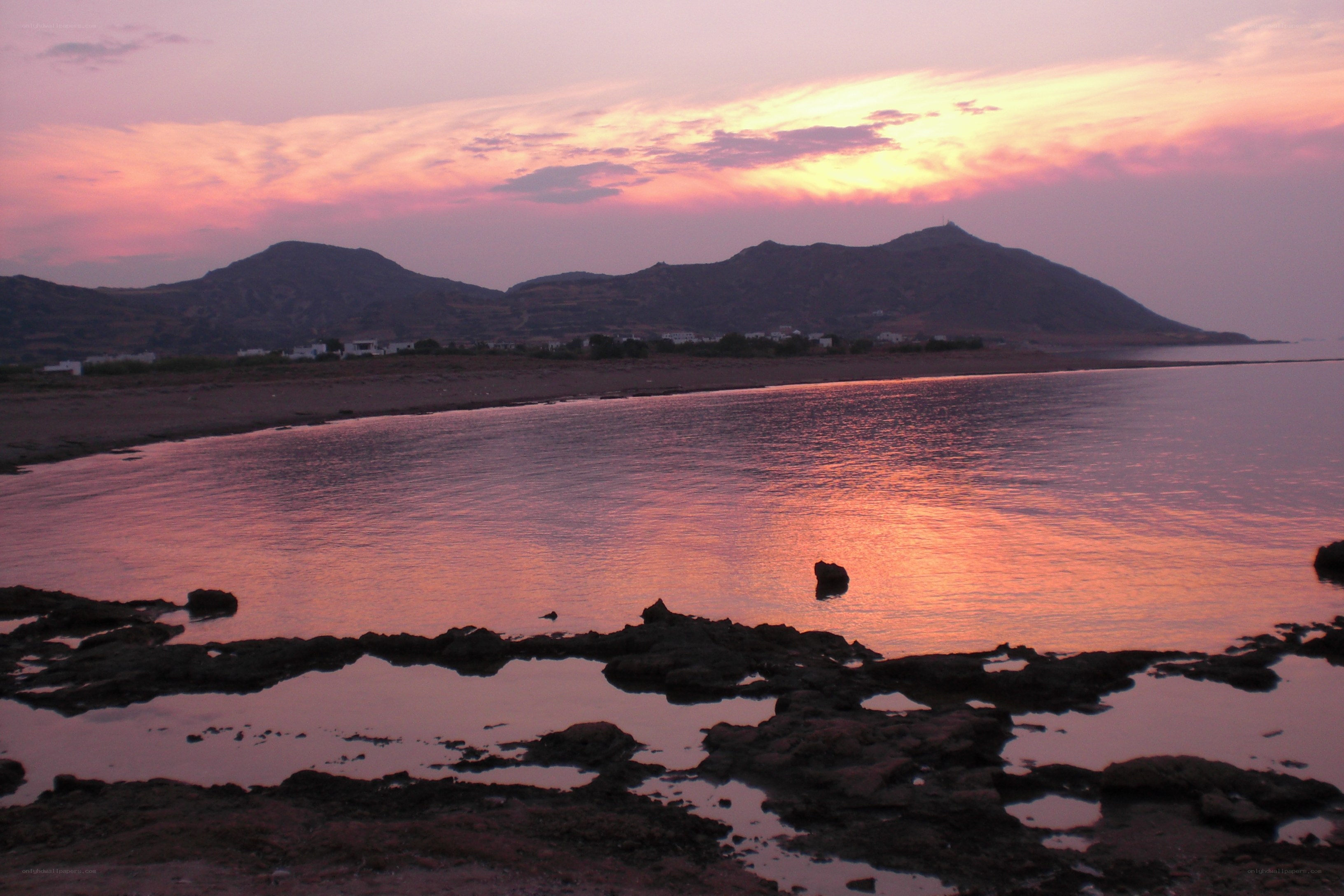 sunset over coastal mountains