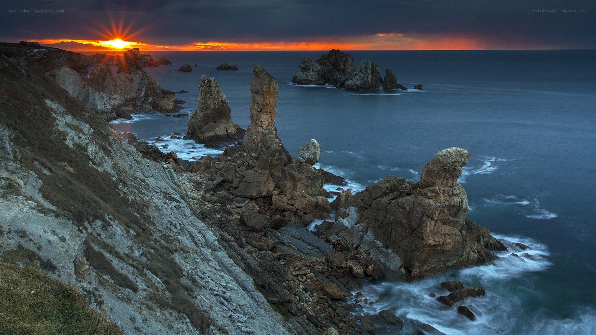 Sunset over coastal rock formations