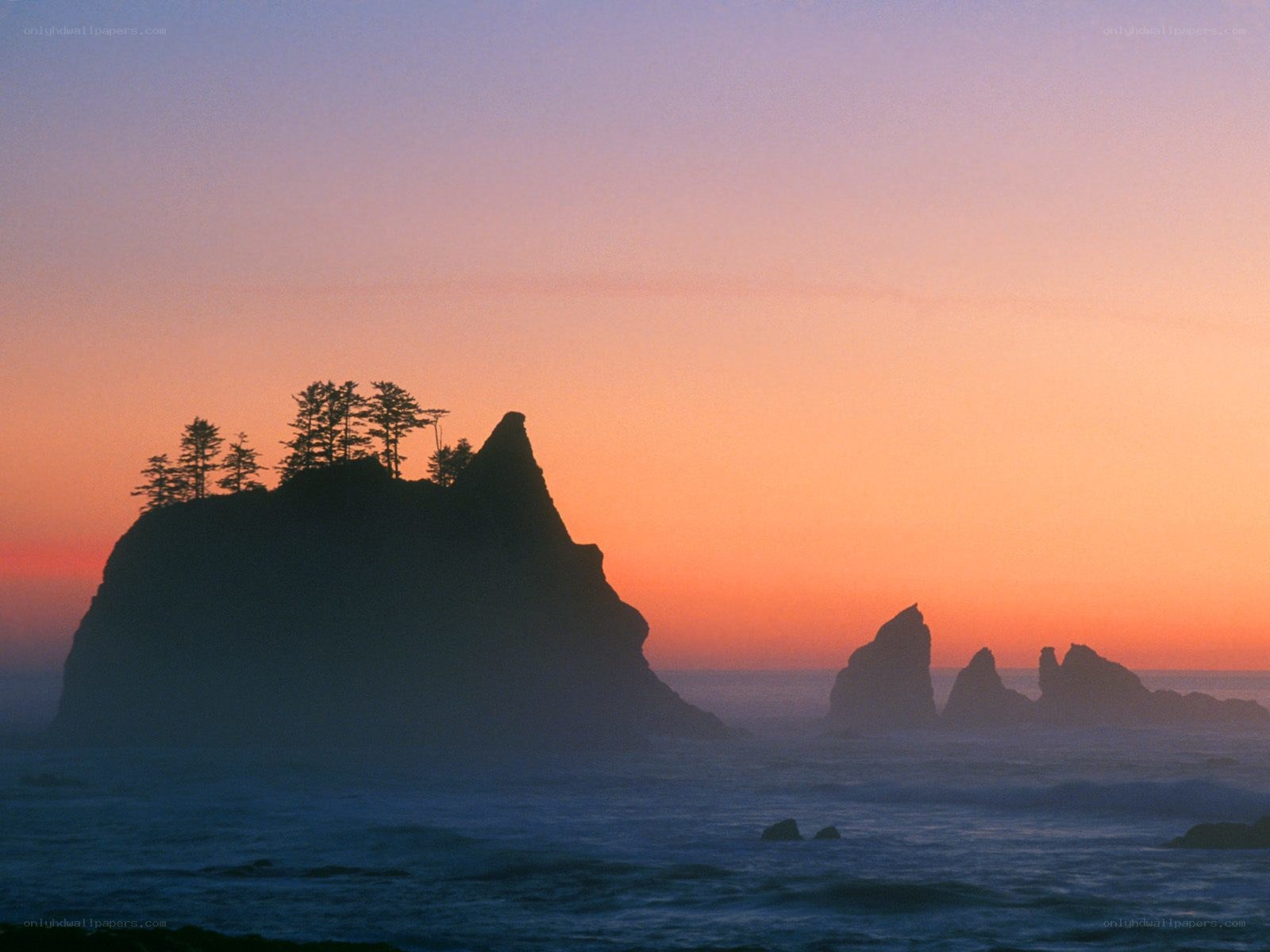 Sunset over coastal rock formations