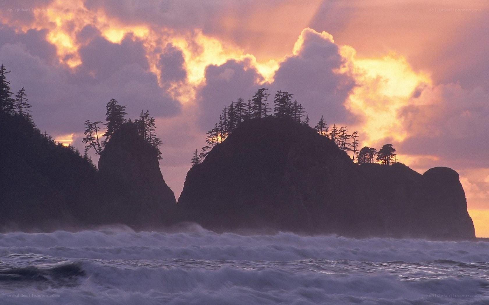 Sunset over coastal rock formations