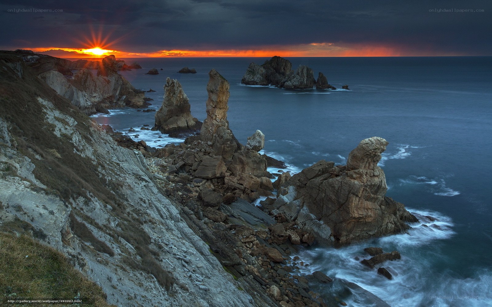Sunset over coastal rock formations