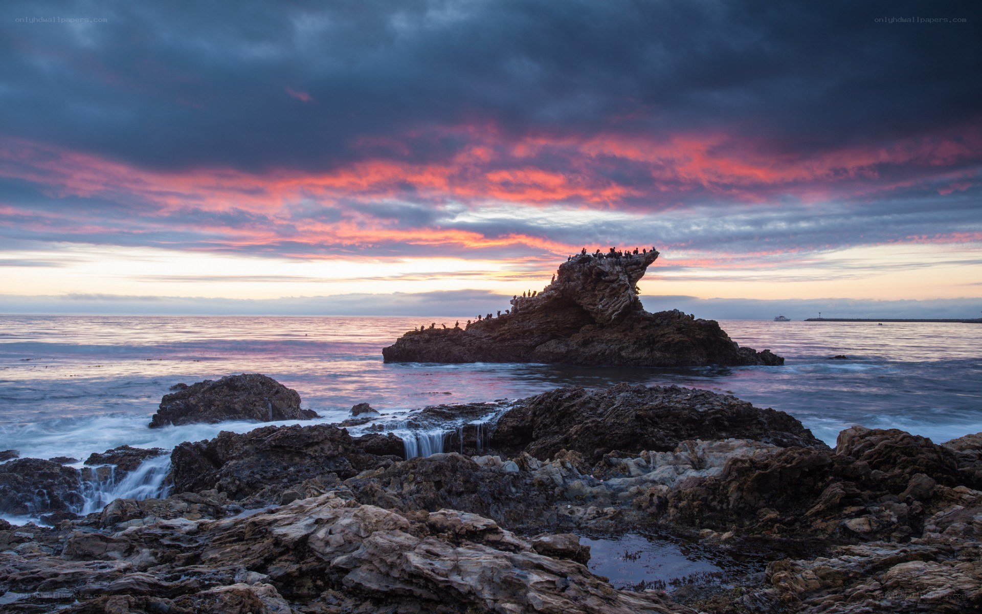 Sunset over coastal rocks
