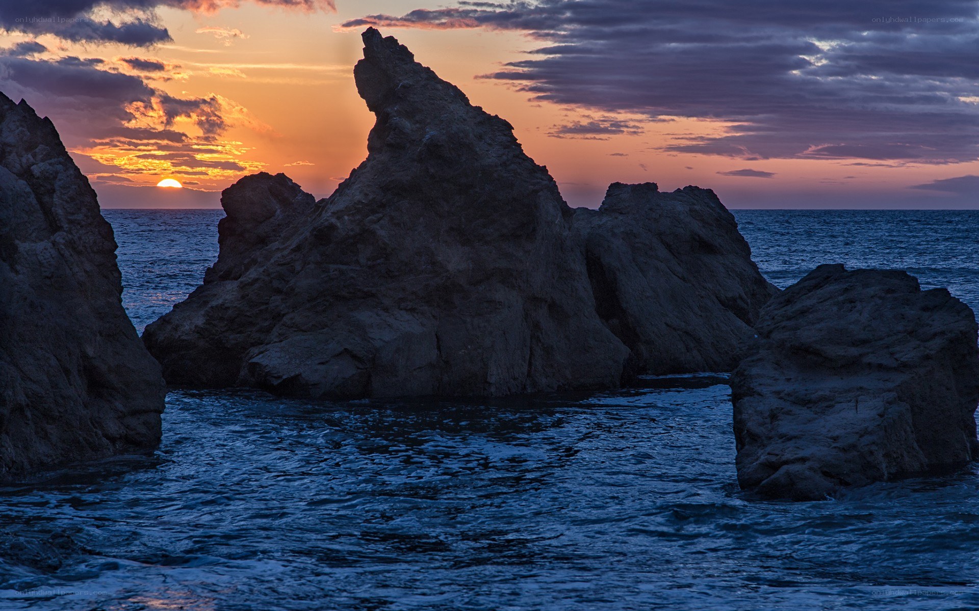 Sunset over coastal rocks