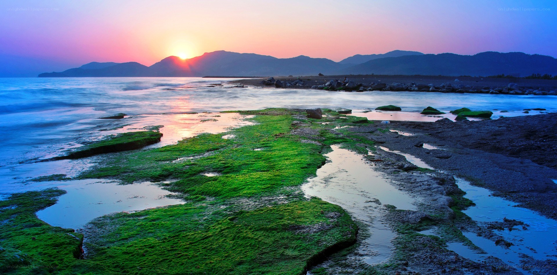 Sunset over coastal rocks
