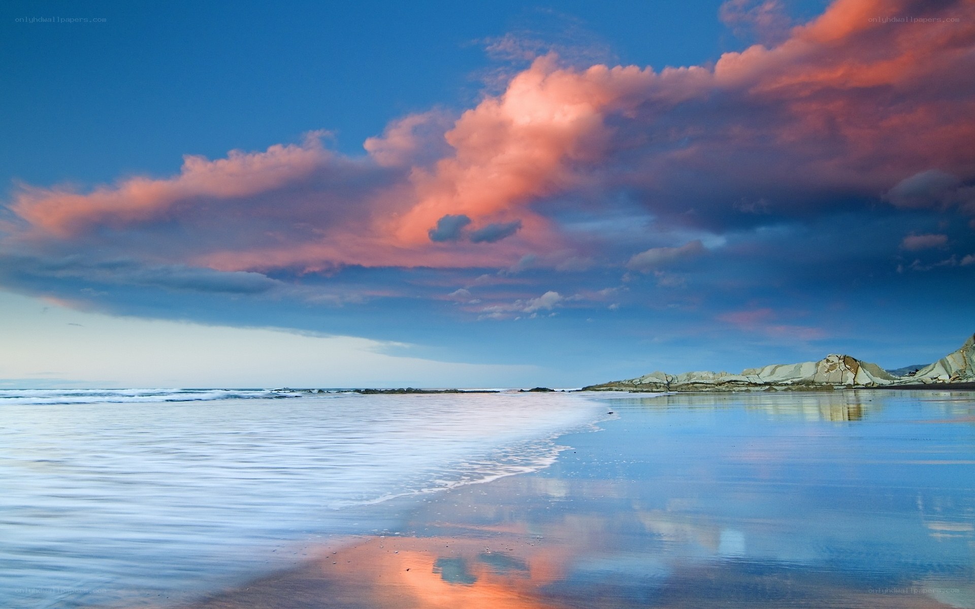 sunset over coastal rocks