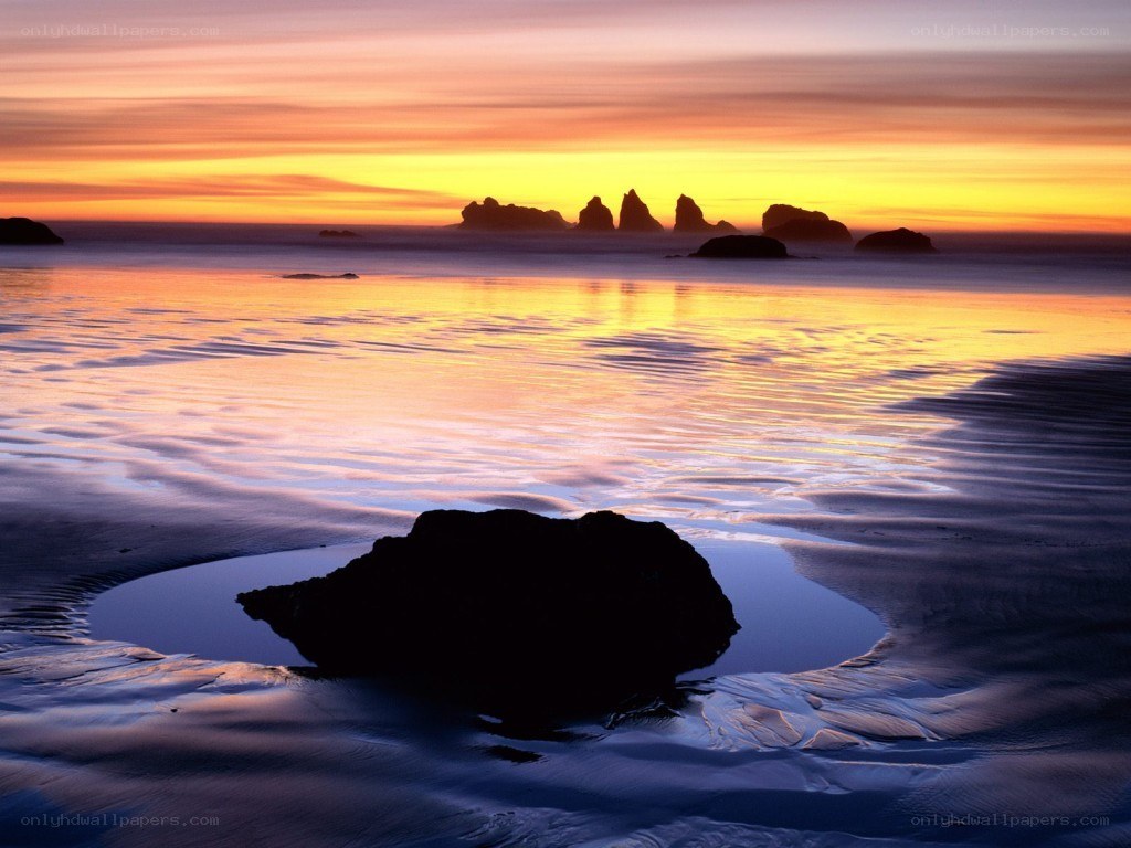 sunset over coastal rocks