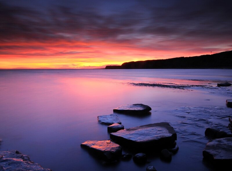 sunset over coastal rocks
