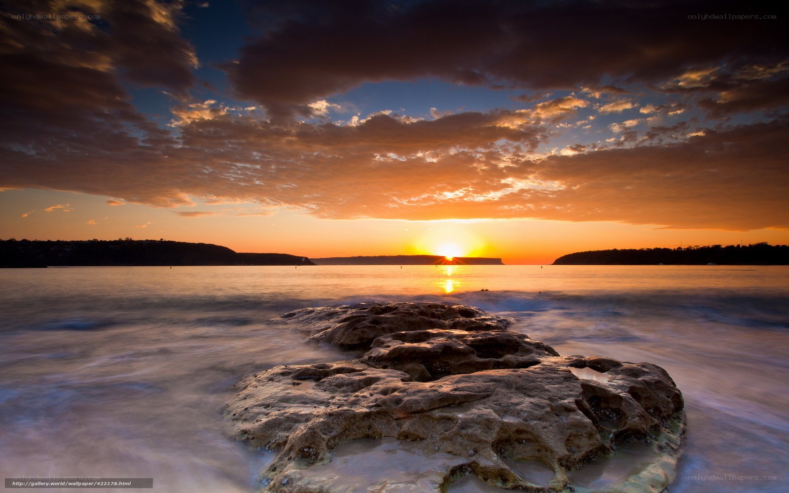 Sunset over coastal rocks