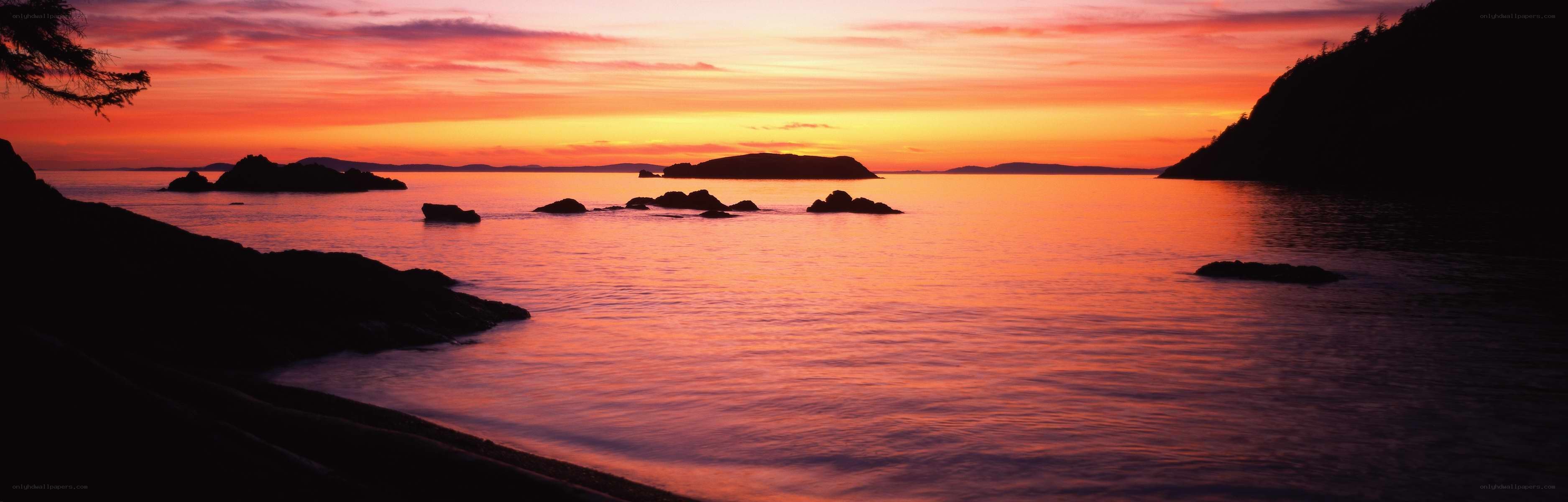 sunset over coastal rocks