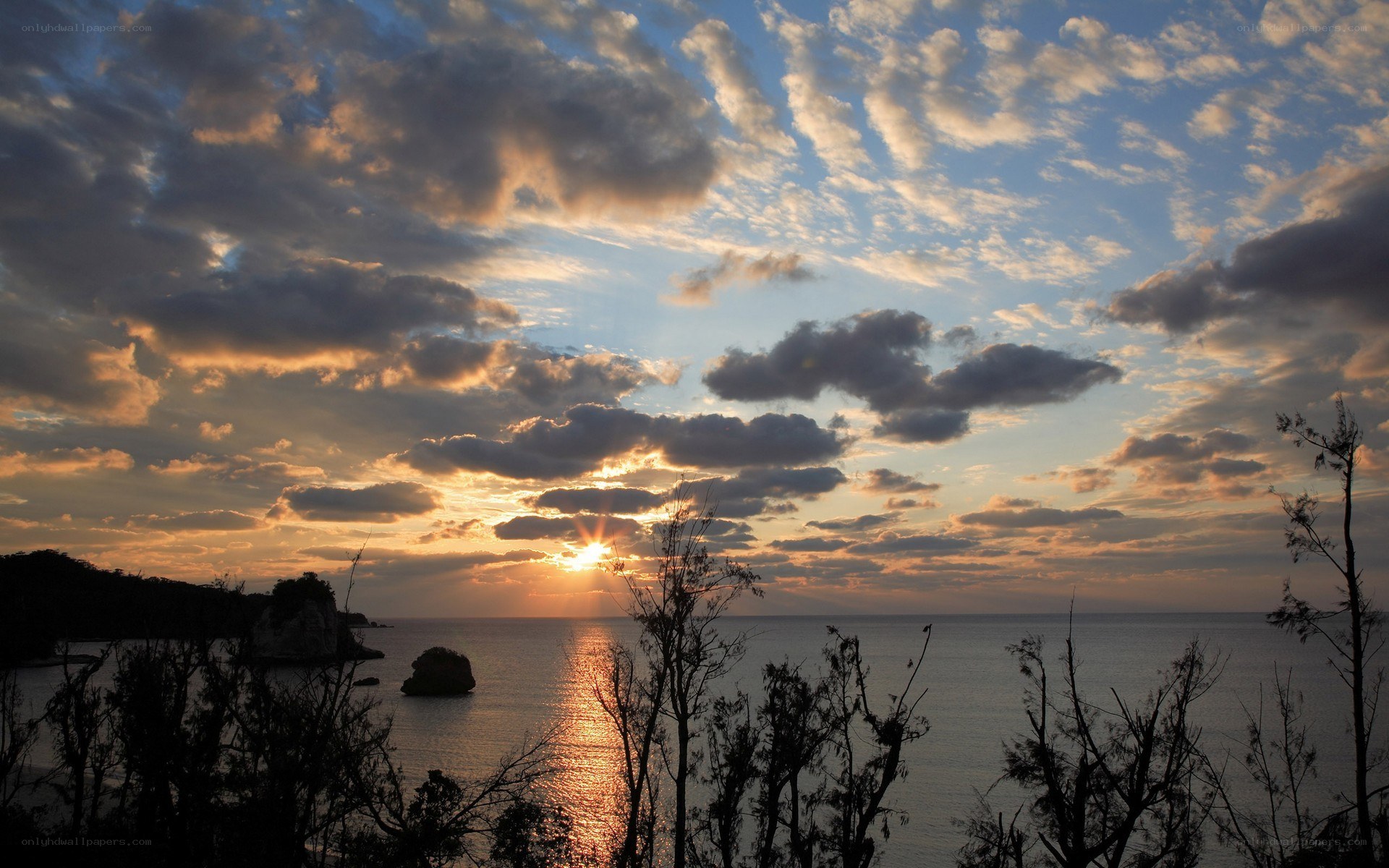 sunset over coastal rocks