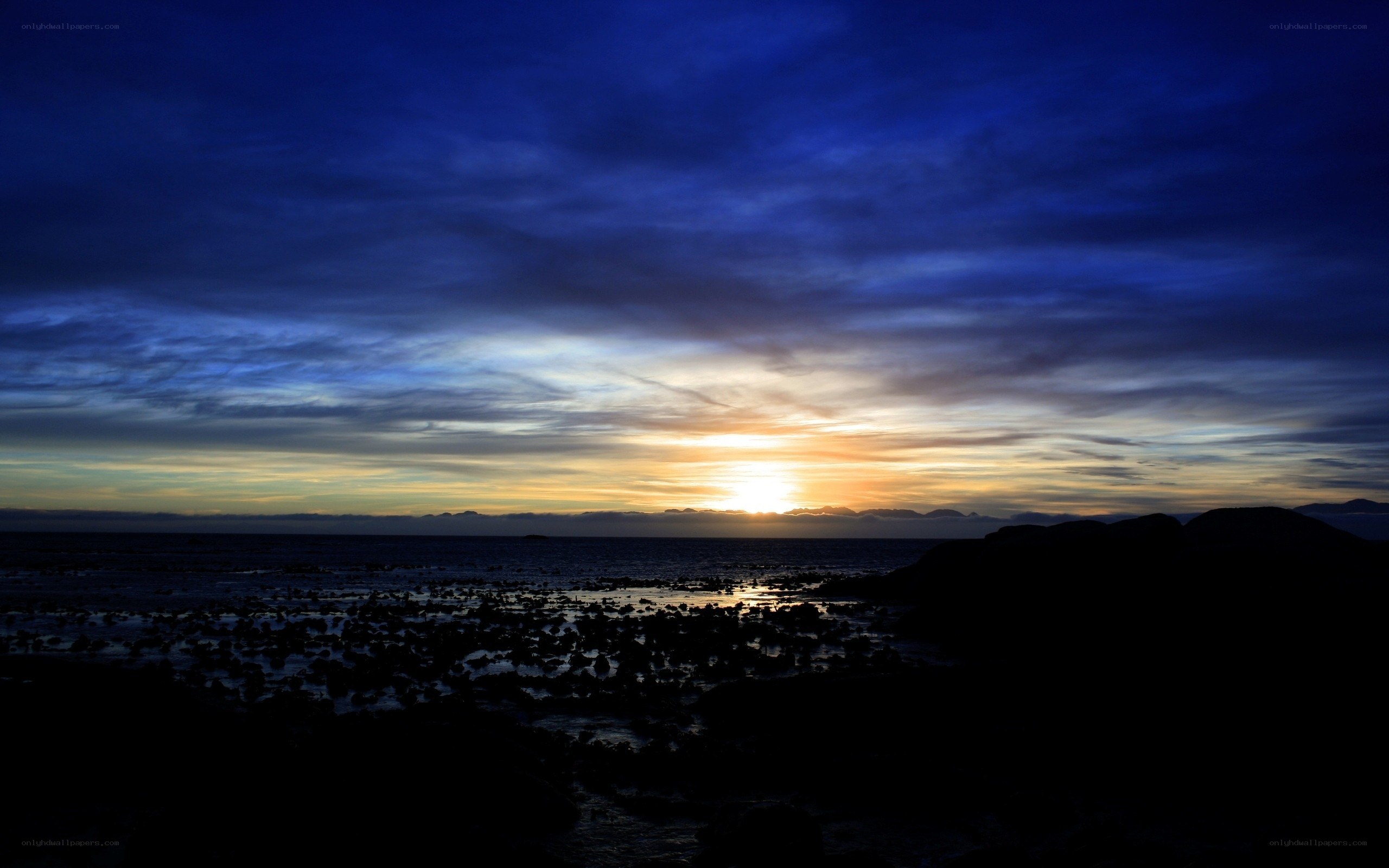 Sunset over coastal rocks