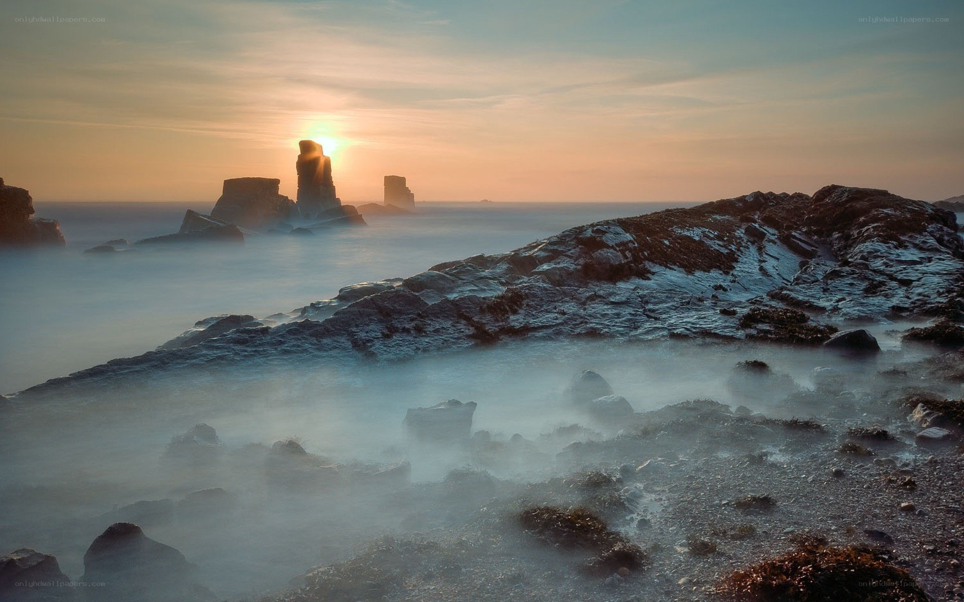 Sunset over coastal rocks