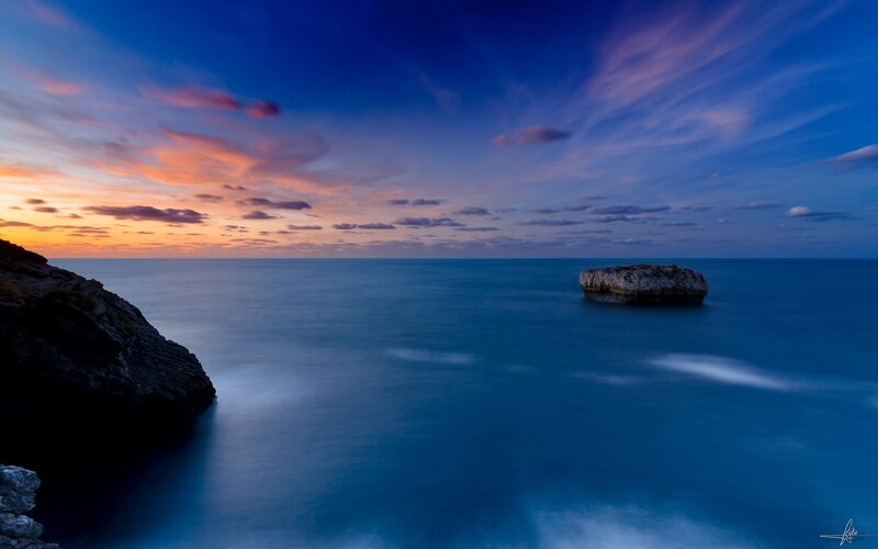 Sunset over coastal rocks