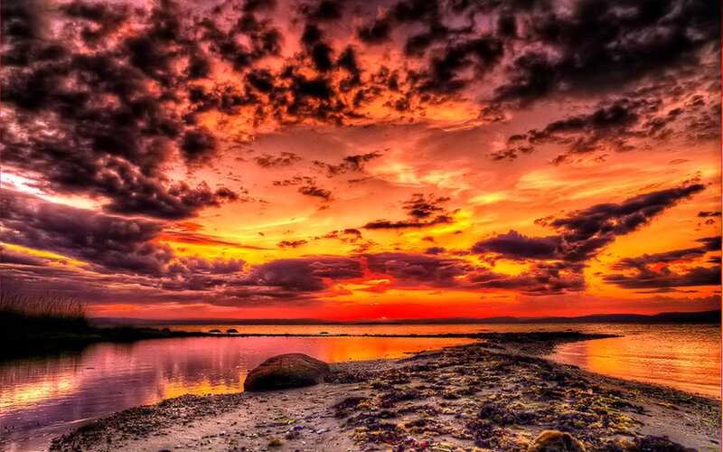 Sunset over Coastal Shore — Orange, Dramatic