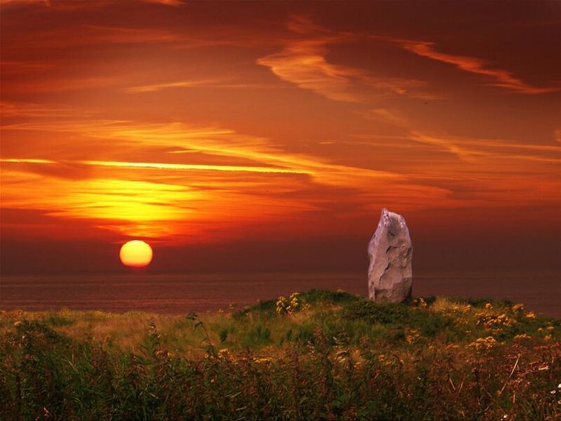 Sunset over coastal stone