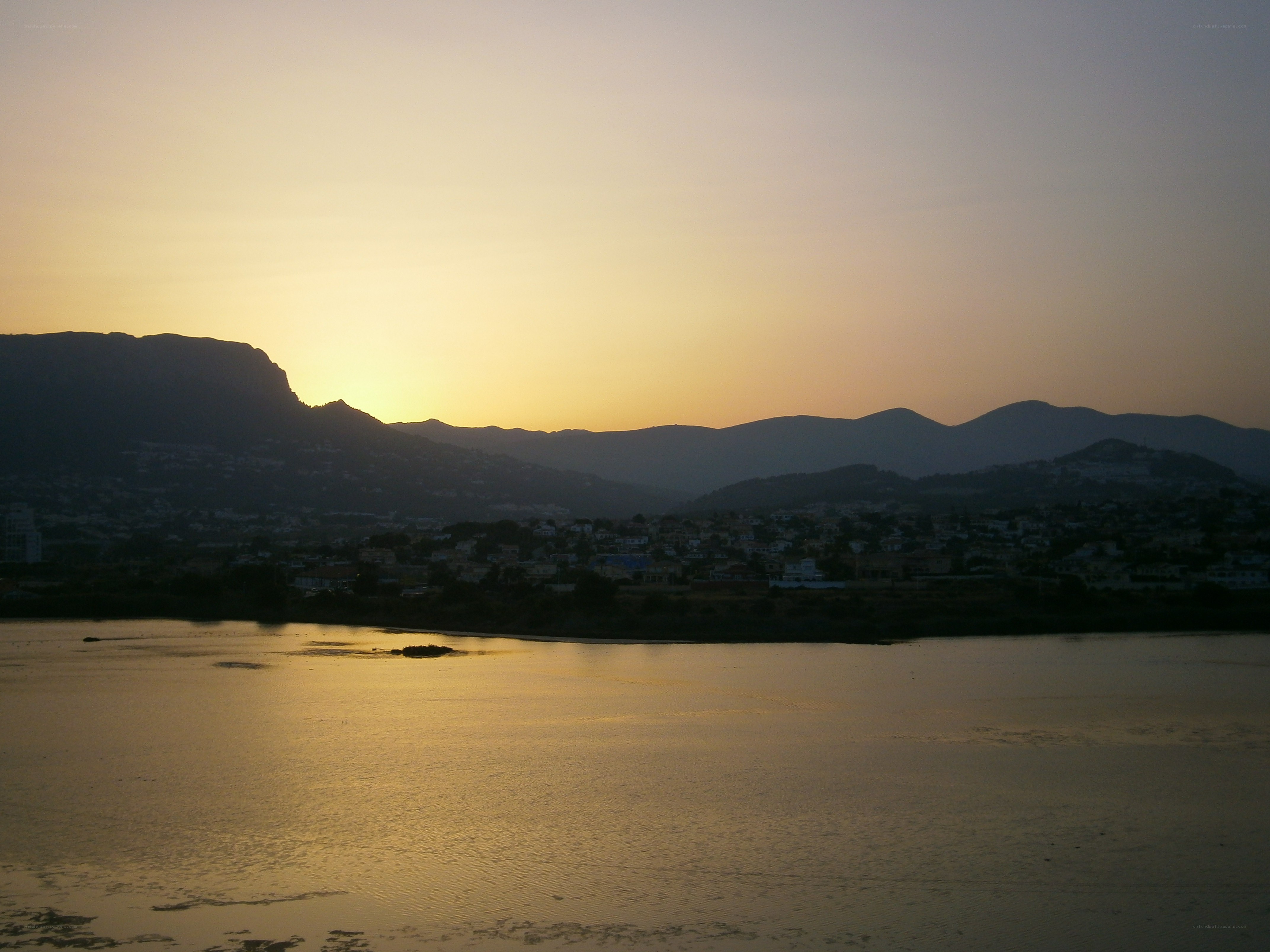 sunset over coastal town