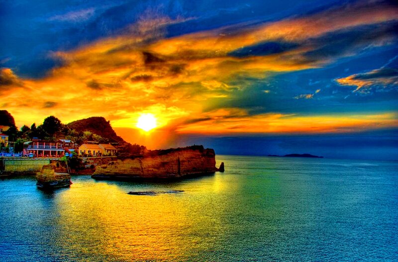 Sunset over Coastal Town — Blue, Dramatic, Photograph, Sea