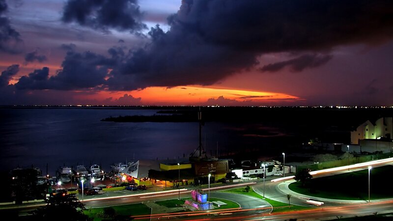 Sunset over Coastal Town — Orange, Dramatic, Photograph, Water