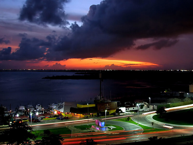 Sunset over Coastal Town — Orange, Dramatic