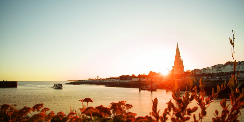 Sunset over Coastal Town — Orange, Serene, Photograph, Church Steeple