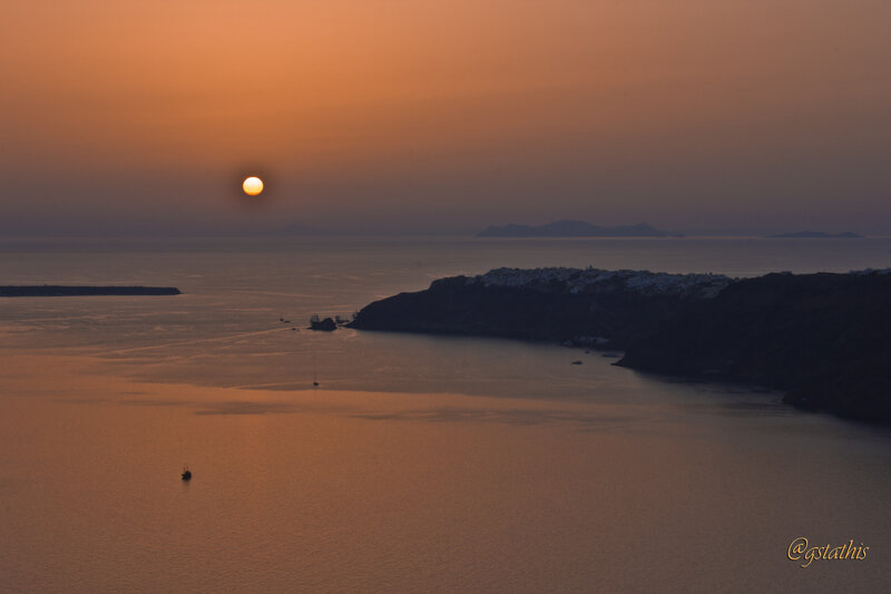 Sunset over Coastal Town — Orange, Serene, Photograph, Sun