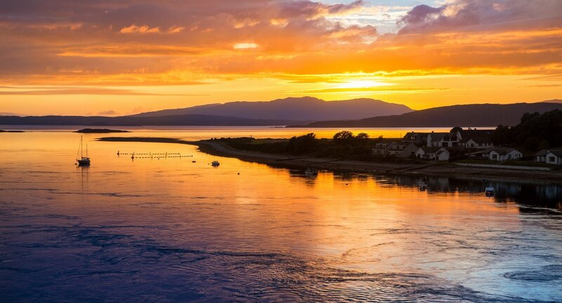 Sunset over Coastal Village — Orange, Serene, Photograph, Mountains