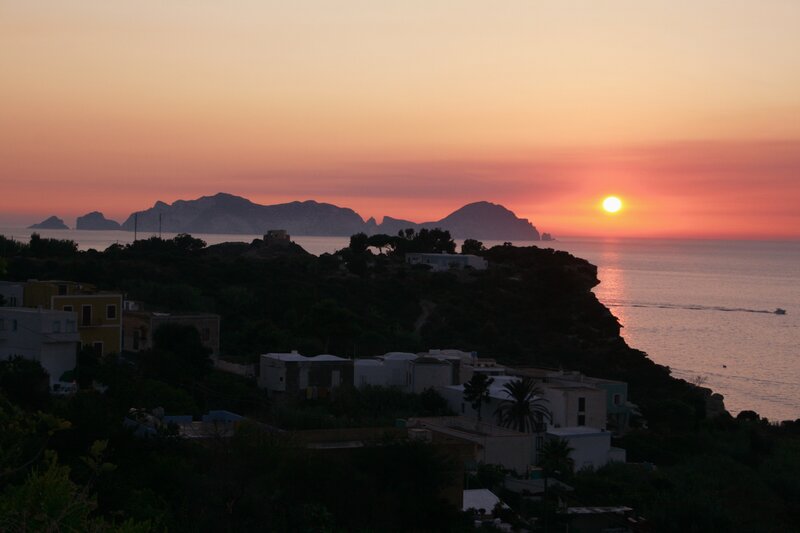 Sunset over Coastal Village — Orange, Serene
