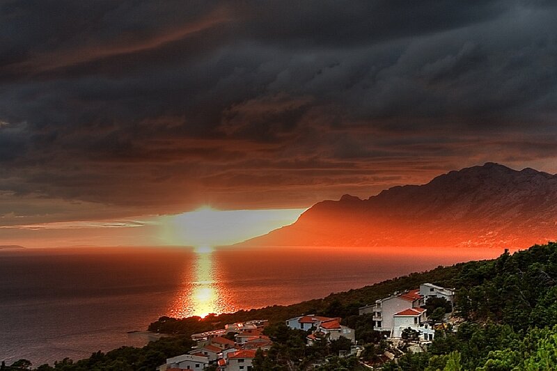 Sunset over Coastal Village — Orange