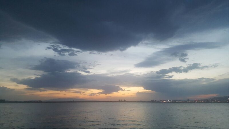 Sunset over Coastal Water — Gray, Dramatic