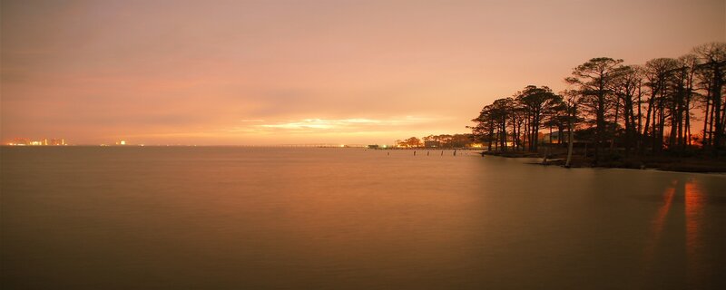 sunset over coastal water