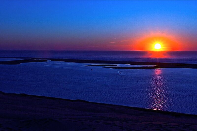 Sunset over Coastal Waters — Blue