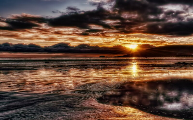 Sunset over Coastal Waters — Orange