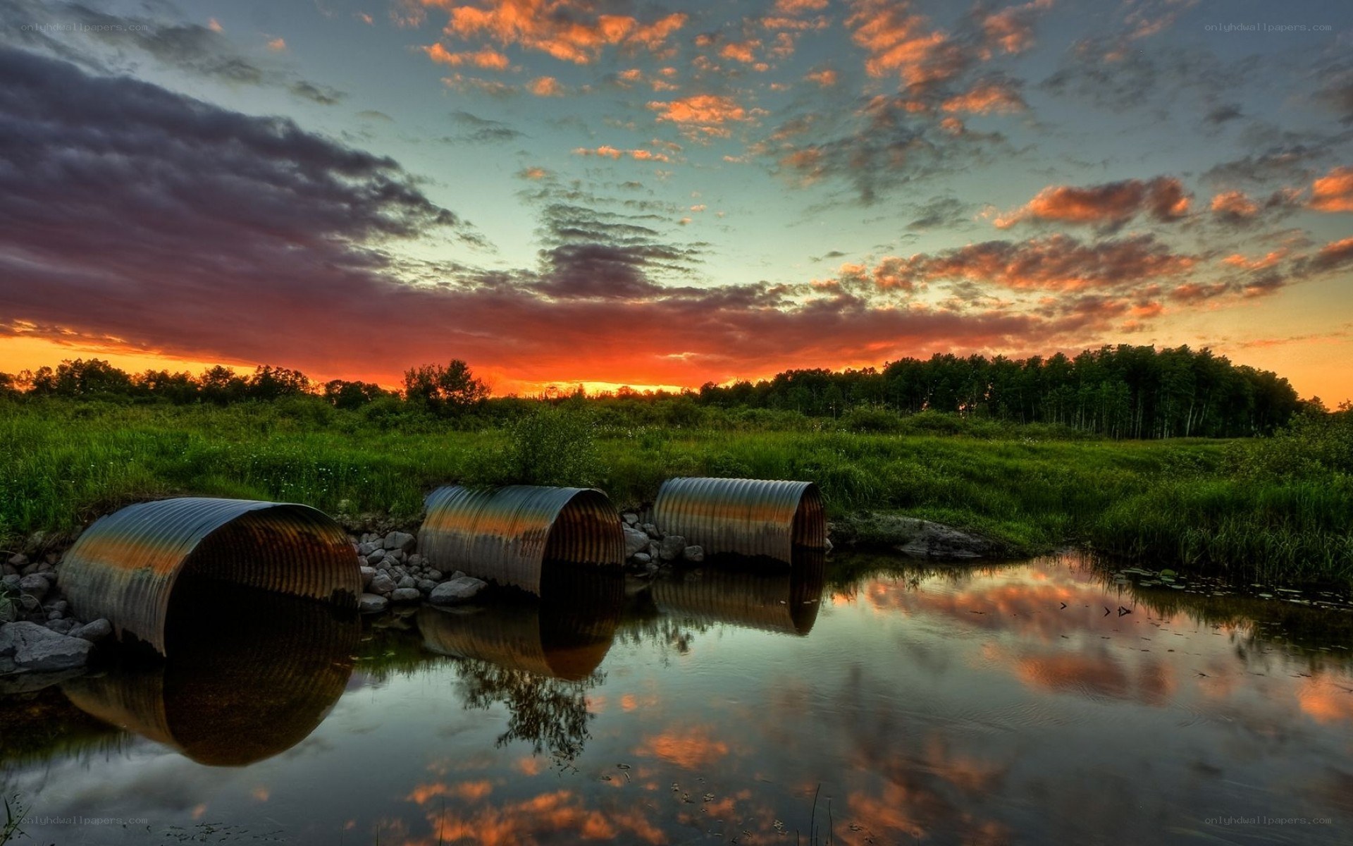 Sunset over corrugated pipes