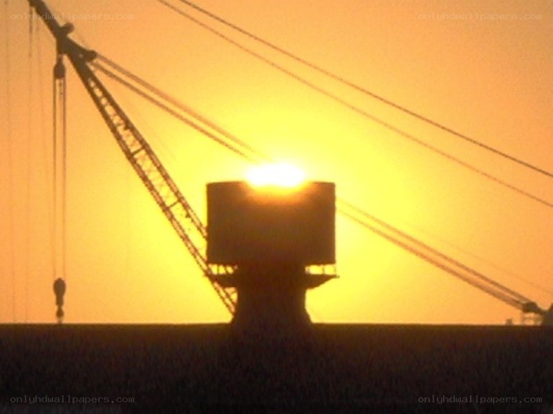 Sunset over crane silhouette
