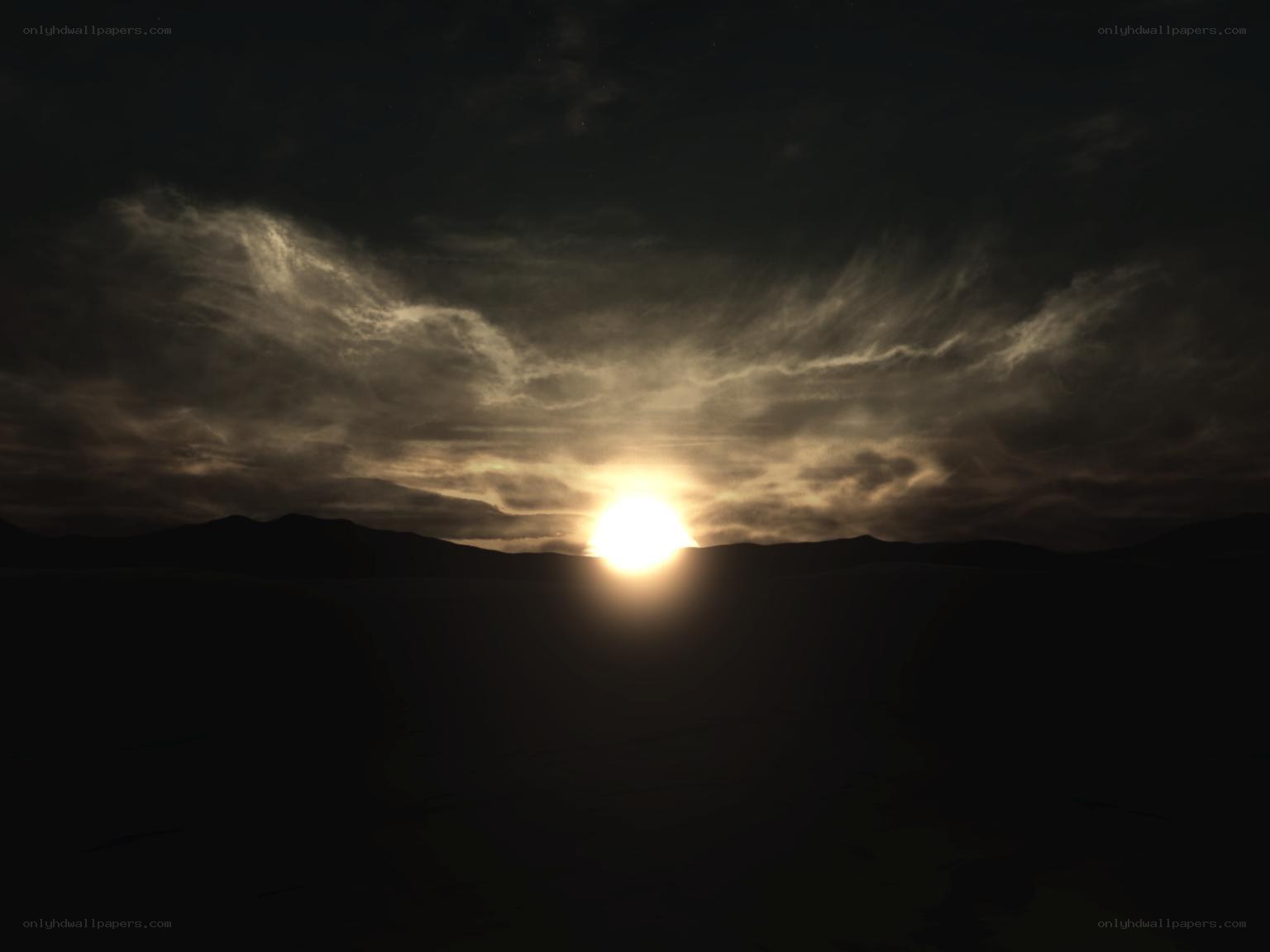 Sunset over dark mountains