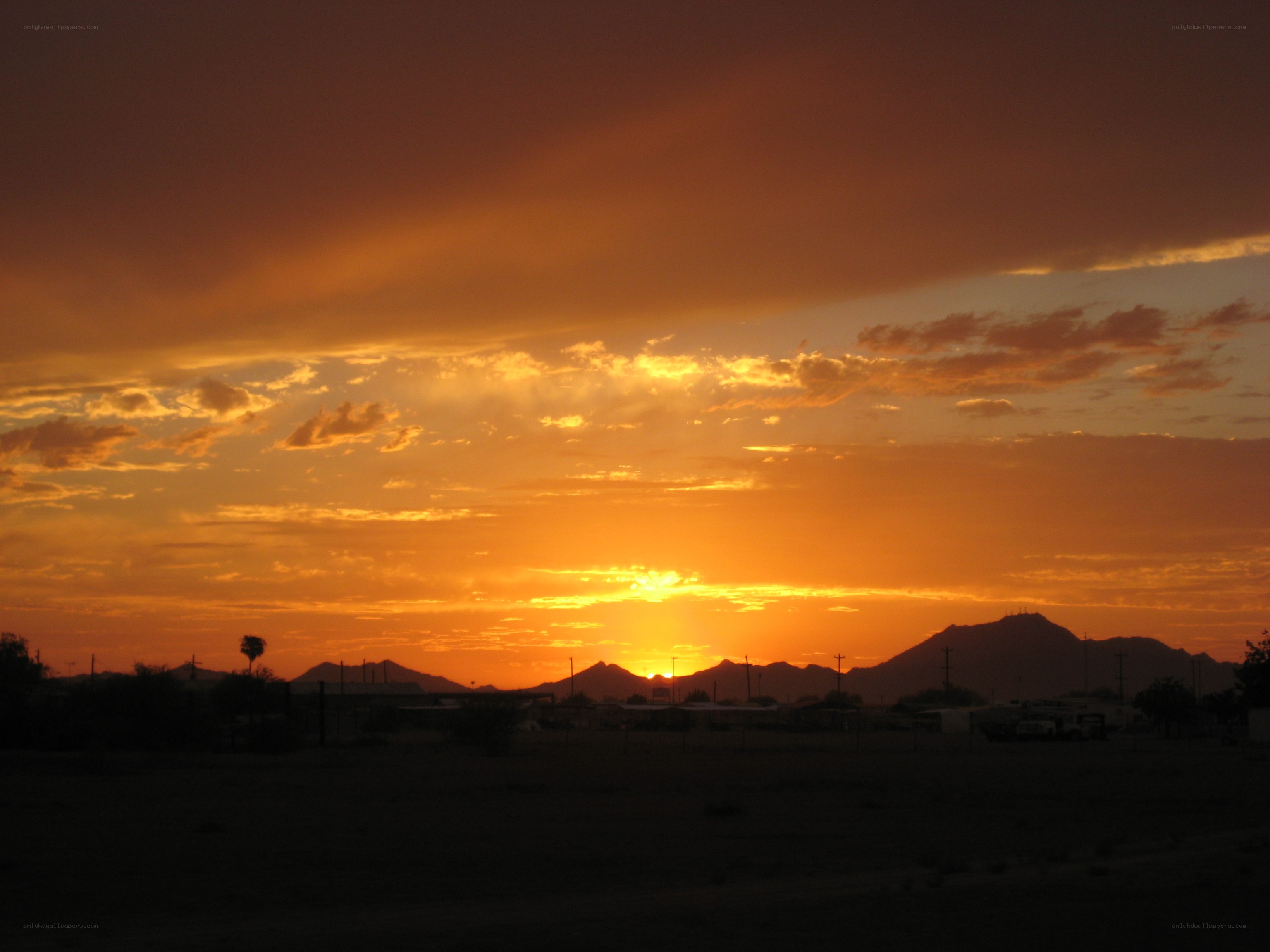 sunset over desert mountains