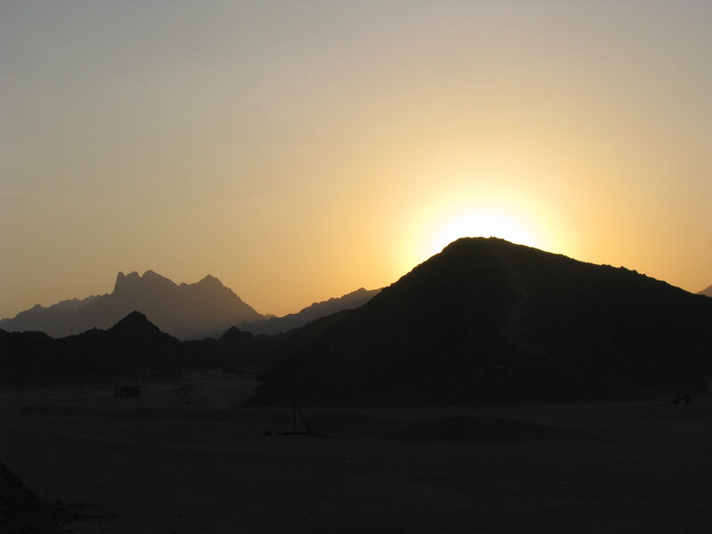 Sunset over desert mountains
