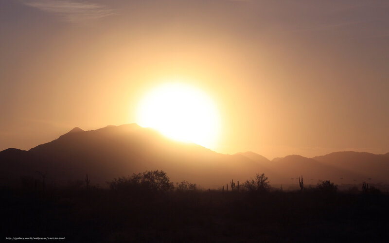 Sunset over desert mountains