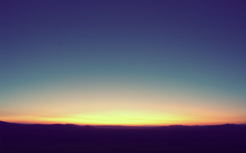 sunset over distant hills