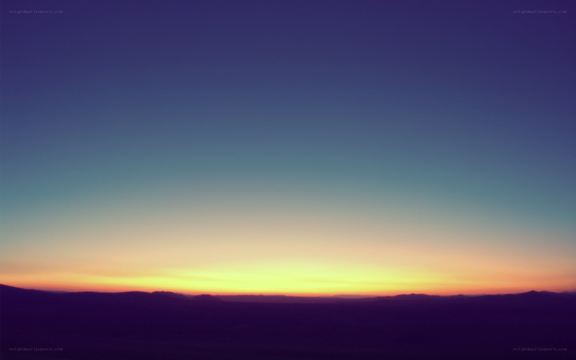 sunset over distant hills