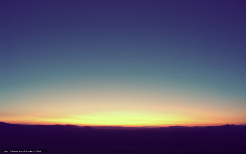 Sunset over distant hills