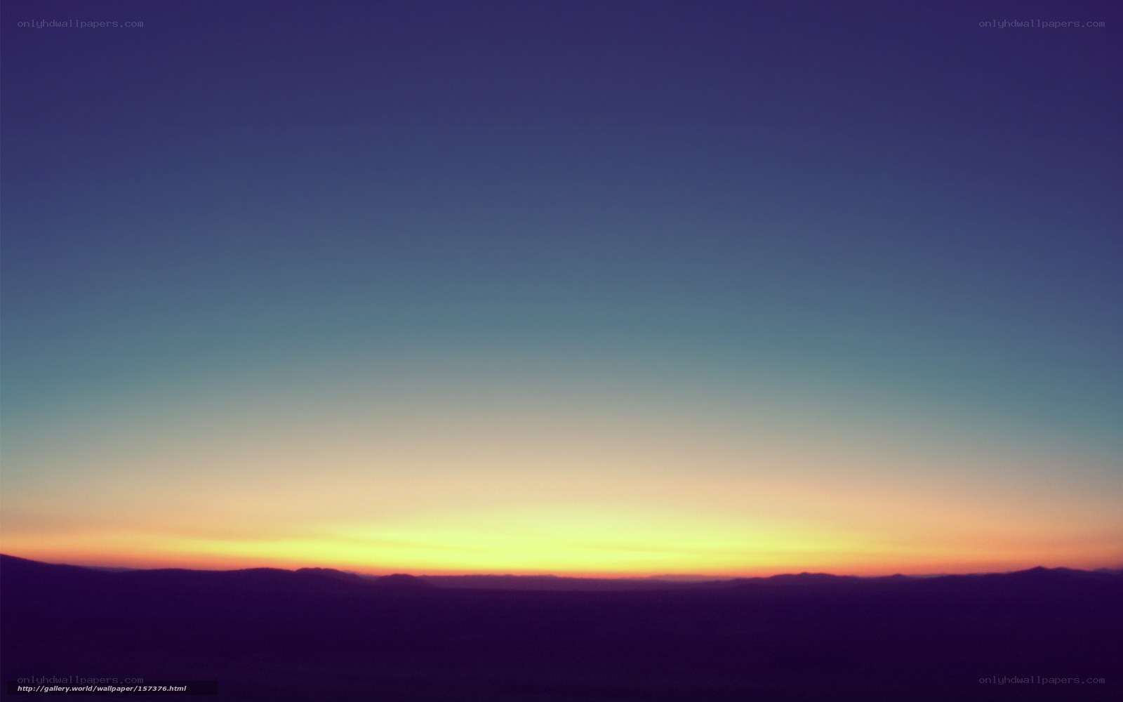 Sunset over distant hills