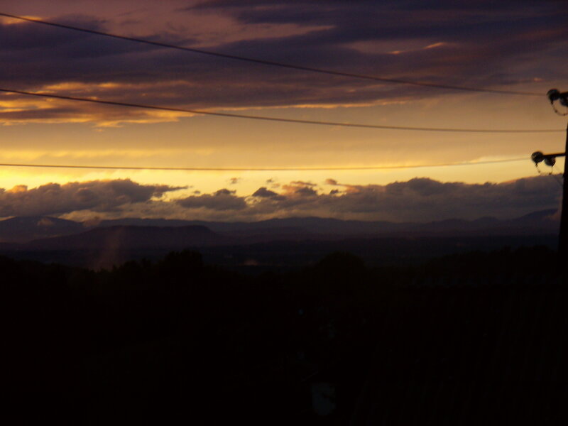 sunset over distant mountains